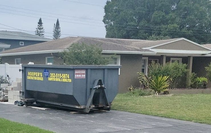 Hoopers 15-yard dumpster on a Spring Hill driveway